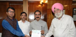 Cheque 11 Lakhs by Shri J. Singh, General Manager and Shri P. Bose, Executive (Finance) of Ganpati Ropeways Private Ltd., Sri Naina Devi ji,